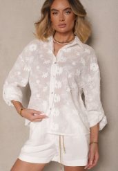 Biała Bawełniana Koszula o Kroju Oversize z Haftem w Kwiatowy Wzór Reisariel. Białe bluzki damskie Renee, m, bez wzorów, z bawełny, eleganckie, bez kołnierzyka, bez ramiączek. Za 84.99 zł.