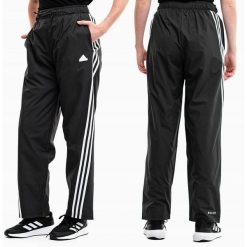 Adidas spodnie dresowe damskie sportowe treningowe Future Icons. Czarne obuwie sportowe damskie Adidas, bez wzorów, z dresówki, na fitness i siłownię. Za 229.99 zł.
