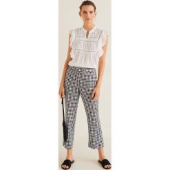 Mango - Spodnie Lineti. Czarne legginsy damskie marki Mango, bez wzorów, z bawełny. Za 119.90 zł.