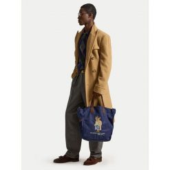 Torebka Polo Ralph Lauren. Niebieskie torebki do ręki damskie Polo Ralph Lauren, bez wzorów, klasyczne, bez dodatków. Za 919.99 zł.