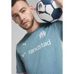 Męska koszulka treningowa Olympique Marsylia PUMA Bold Blue Putty Beige. Brązowe koszulki sportowe męskie Puma, m, bez wzorów, bez kołnierzyka, bez ramiączek, do piłki nożnej. Za 214.00 zł.