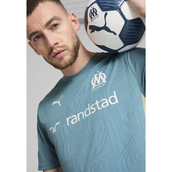 Męska koszulka treningowa Olympique Marsylia PUMA Bold Blue Putty Beige. Brązowe koszulki sportowe męskie Puma, m, bez wzorów, bez kołnierzyka, bez ramiączek, do piłki nożnej. Za 214.00 zł.
