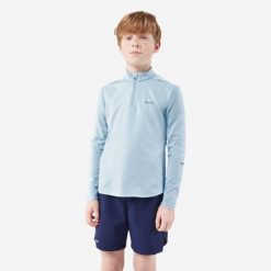 Koszulka tenisowa długi rękaw dla dzieci Artengo Thermic na krótki suwak. Niebieskie t-shirty dla chłopców KUIKMA, bez wzorów, z materiału, bez ramiączek. Za 44.99 zł.