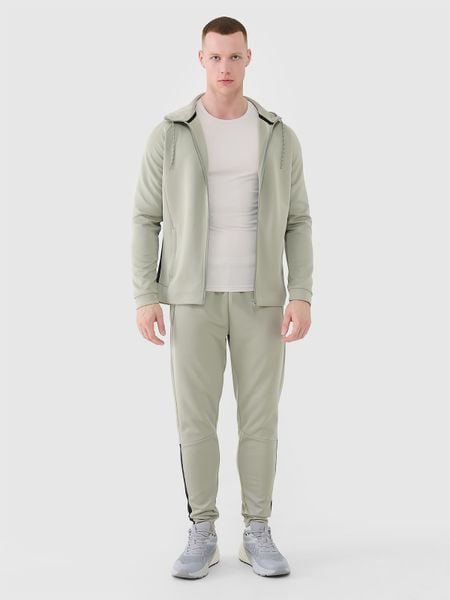 4F Spodnie treningowe szybkoschnące męskie - khaki L. Brązowe spodnie sportowe męskie 4f, l, bez wzorów, z dresówki, na fitness i siłownię. W wyprzedaży za 129.99 zł.