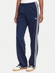 Adidas Spodnie dresowe Firebird Classic KS4795 Granatowy Regular Fit. Niebieskie spodnie dresowe damskie Adidas, l, bez wzorów, z dresówki. Za 299.99 zł.