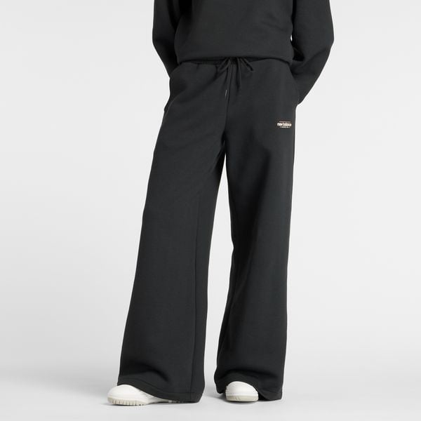 Spodnie damskie New Balance WP53903BK – czarne. Czarne spodnie materiałowe damskie New Balance, m, z aplikacjami, z bawełny, z podwyższonym stanem. Za 279.99 zł.