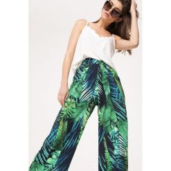 Granatowo-Zielone Spodnie Tropical Forest. Niebieskie spodnie materiałowe damskie Born2be, l, bez wzorów, z materiału. Za 39.99 zł.