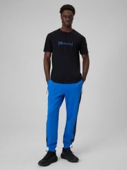 4F Spodnie dresowe joggery męskie - niebieskie M. Niebieskie spodnie sportowe męskie 4f, m, bez wzorów, z dresówki, na fitness i siłownię. Za 159.99 zł.