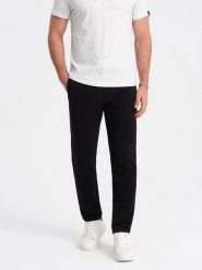 Dresowe spodnie męskie z nogawką bez ściągacza - czarne V5. Czarne spodnie sportowe męskie Ombre Clothing, l, bez wzorów, z bawełny. W wyprzedaży za 127.49 zł.
