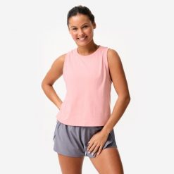 Koszulka bez rękawów damska Domyos Gym & Pilates Crop Top. Czerwone koszulki sportowe damskie DOMYOS, s, bez wzorów, z bawełny, bez kołnierzyka, bez ramiączek, na fitness i siłownię. Za 39.99 zł.