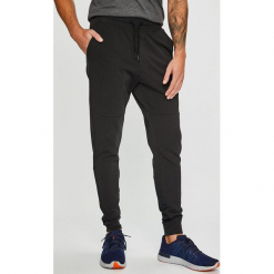Under Armour - Spodnie Terry. Szare spodnie sportowe męskie Under Armour, z bawełny. W wyprzedaży za 199.90 zł.