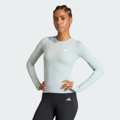 Koszulka Power Essentials Workout Contour Long Sleeve. Zielone koszulki sportowe damskie Adidas, bez wzorów, sportowe, bez kołnierzyka. Za 149.00 zł.