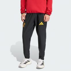 Spodnie Belgium Tiro Travel. Czarne spodnie sportowe męskie Adidas, bez wzorów, z dresówki, do piłki nożnej. Za 329.00 zł.