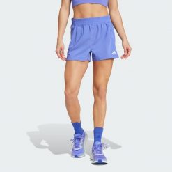 Szorty Own the Run. Niebieskie szorty sportowe damskie Adidas, xl, bez wzorów, z materiału, klasyczne, z standardowym stanem, do biegania. Za 179.25 zł.