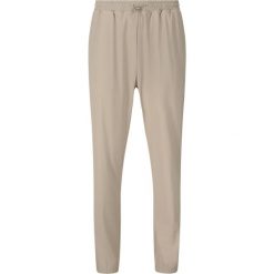 Damskie spodnie dresowe Athlecia Amisa. Brązowe spodnie dresowe damskie Athlecia, bez wzorów, z dresówki. Za 246.50 zł.