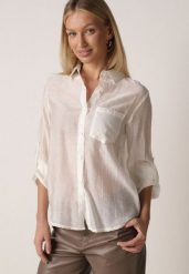 Jasnobeżowa Transparentna Koszula Ozdobiona Cyrkoniami Clymadia. Brązowe bluzki damskie Born2be, l, bez wzorów, z jeansu, klasyczne, bez kołnierzyka, bez ramiączek. Za 79.99 zł.