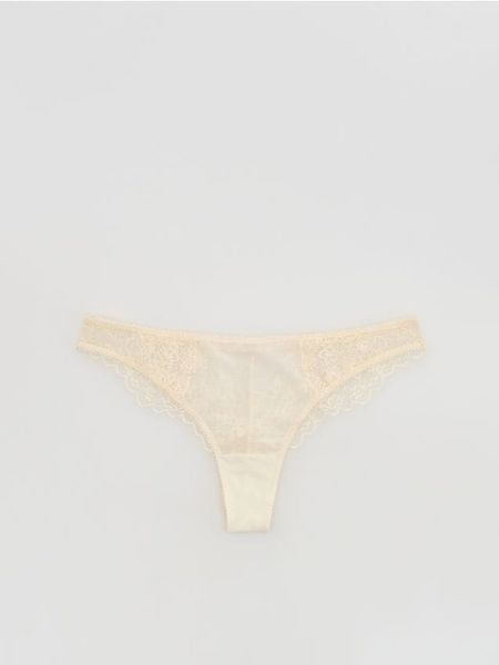 Koronkowe majtki stringi - złamana biel. Stringi damskie Reserved, l, bez wzorów, z koronki. W wyprzedaży za 27.99 zł.