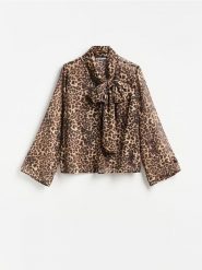 Bluzka w panterkę - brązowy. Brązowe bluzki damskie Reserved, l, bez wzorów, z tkaniny, bez kołnierzyka, bez ramiączek. Za 109.99 zł.