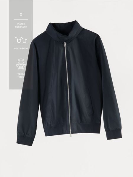 Kurtka z chowanym kapturem - granatowy. Niebieskie kurtki męskie Reserved, l, bez wzorów, z tkaniny. Za 159.99 zł.