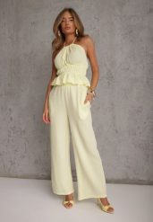 Żółty Letni Komplet z Bawełny Spodnie Wide Leg i Bluzka Halter z Wiązaniem Apomeda. Żółte bluzki damskie Renee, bez wzorów, z bawełny, casualowe, bez kołnierzyka, bez ramiączek. Za 169.99 zł.