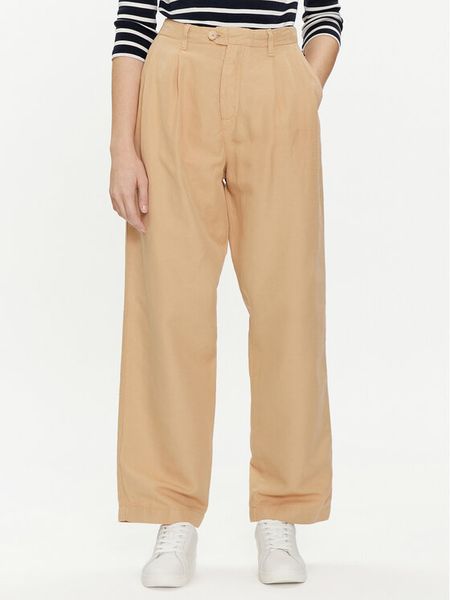 Tommy Hilfiger Spodnie materiałowe WW0WW41355 Beżowy Relaxed Fit. Brązowe spodnie materiałowe damskie Tommy Hilfiger, bez wzorów, z bawełny. Za 399.99 zł.