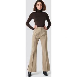 NA-KD Classic Spodnie garniturowe Seamline - Beige. Spodnie materiałowe damskie marki NA-KD Classic. Za 202.95 zł.