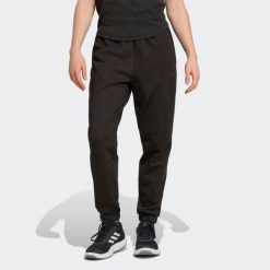 Spodnie fitness damskie ADIDAS. Czarne obuwie sportowe damskie Adidas, l, bez wzorów, z materiału, na fitness i siłownię. Za 269.99 zł.