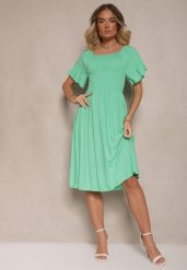 Jasnozielona Sukienka Rozkloszowana z Bawełny z Bufkami w Ramionach i Gumkami w Biuście Norlio. Zielone sukienki dla dziewczynek Renee, bez wzorów, z bawełny, eleganckie, bez ramiączek. Za 39.99 zł.