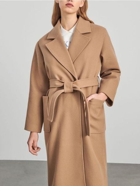 Płaszcz z wiązaniem - kremowy. Białe płaszcze damskie Sinsay, l, bez wzorów, eleganckie, bez kaptura. Za 139.99 zł.