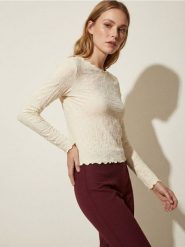 Strukturalna bluzka z długimi rękawami - żółty. Żółte bluzki damskie Sinsay, l, bez wzorów, bez kołnierzyka, bez ramiączek. Za 29.99 zł.