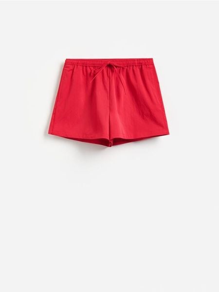 Szorty z bawełną - czerwony. Czerwone szorty damskie Reserved, l, bez wzorów, z bawełny. W wyprzedaży za 49.99 zł.