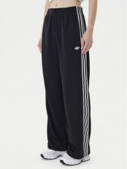Adidas Spodnie dresowe adicolor Firebird JV7525 Czarny Regular Fit. Czarne spodnie dresowe damskie Adidas, xl, bez wzorów, z dresówki. Za 269.99 zł.
