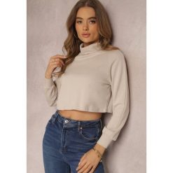 Jasnobeżowy Golf Crop Top Noya. Brązowe swetry damskie Renee, na jesień, l, z aplikacjami, z bawełny, bez kołnierzyka, bez ramiączek, długie, bez kaptura. Za 49.99 zł.