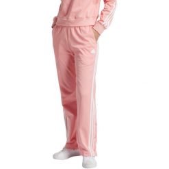 Spodnie damskie adidas Iconic Wrapping 3-Stripes Snap. Czerwone obuwie sportowe damskie Adidas, bez wzorów, z bawełny, na fitness i siłownię. Za 229.99 zł.