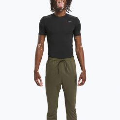Koszulka męska Reebok Compression Tee. Czarne koszulki sportowe męskie Reebok, na lato, l, bez wzorów, z elastanu, bez kołnierzyka, bez ramiączek. Za 99.99 zł.