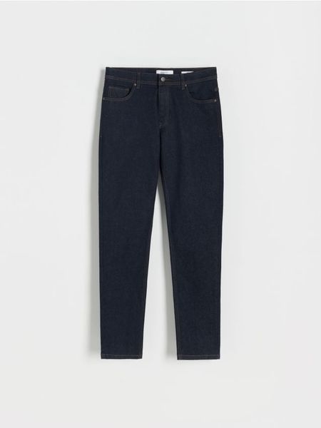 Jeansy slim z efektem sprania - granatowy. Niebieskie jeansy męskie Reserved. W wyprzedaży za 59.99 zł.