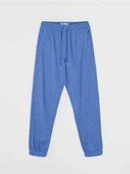 Dresowe spodnie jogger terry - niebieski. Niebieskie spodnie dresowe damskie Sinsay, l, bez wzorów, z dresówki. Za 29.99 zł.