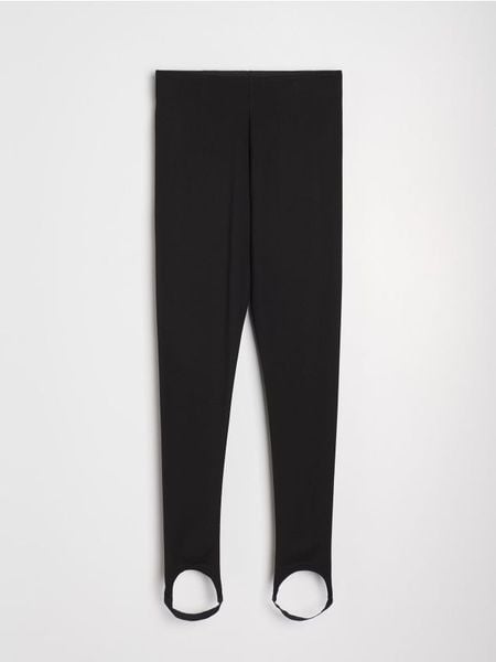 Legginsy z gumką pod stopą - czarny. Czarne legginsy damskie Sinsay, l, bez wzorów. Za 39.99 zł.