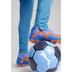 Męskie spodnie treningowe Manchester City PUMA Magic Blue Yellow Glow. Niebieskie spodnie sportowe męskie Puma, l, bez wzorów, do piłki nożnej. W wyprzedaży za 251.50 zł.