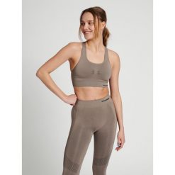 Damski bezszwowy biustonosz sportowy Hummel Shaping. Brązowe obuwie sportowe damskie Hummel, bez wzorów, na fitness i siłownię. Za 122.50 zł.