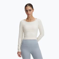Longsleeve treningowy damski Under Armour Train Seamless stone/white. Białe koszulki sportowe damskie Under Armour, bez wzorów, sportowe, bez kołnierzyka. Za 169.99 zł.