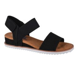 Sandały Skechers Model Desert Kiss Kolor Czarny. Czarne sandały damskie Skechers, bez wzorów, ze skóry, bez obcasa, bez zapięcia. Za 199.99 zł.