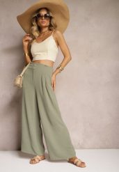 Ciemnozielone Spodnie w Stylu Alladynek High Waist Wykończone Gumką w Pasie Riselma. Zielone spodnie sportowe damskie Renee, bez wzorów, z jeansu. Za 39.99 zł.