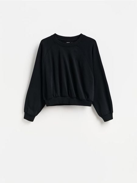 Gładka bluza - czarny. Czarne bluzy damskie Reserved, l, bez wzorów, z bawełny, bez kaptura. Za 69.99 zł.