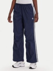 Adidas Spodnie dresowe 3-Stripes JD3127 Granatowy Loose Fit. Niebieskie spodnie dresowe damskie Adidas, m, bez wzorów, z dresówki. Za 209.99 zł.