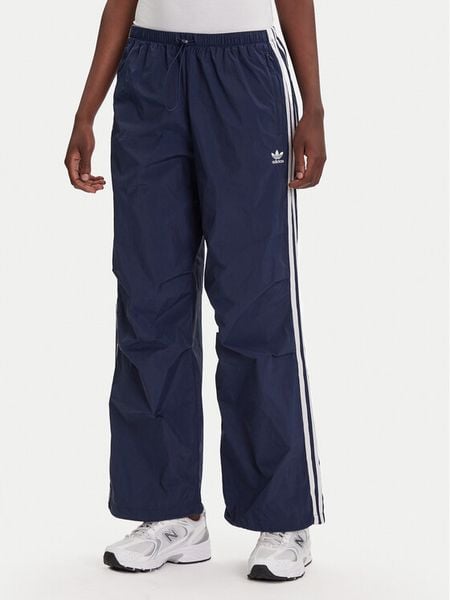 Adidas Spodnie dresowe 3-Stripes JD3127 Granatowy Loose Fit. Niebieskie spodnie dresowe damskie Adidas, m, bez wzorów, z dresówki. Za 179.99 zł.