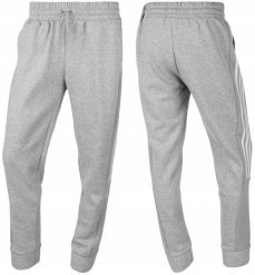 Damskie spodnie dresowe adidas Essentials Colorblock 3-Stripes. Białe spodnie dresowe damskie Adidas, uniwersalny, bez wzorów, z bawełny. Za 129.99 zł.