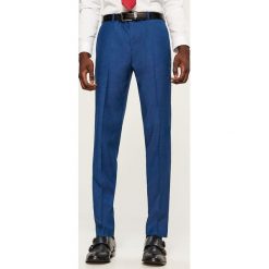 Spodnie garniturowe slim fit - Niebieski. Eleganckie spodnie męskie marki Giacomo Conti. W wyprzedaży za 89.99 zł.