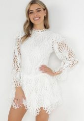 Biała Koronkowa Sukienka Mini z Asymetrycznym Dołem Trudy. Białe sukienki damskie Born2be, na lato, m, bez wzorów, z koronki, z asymetrycznym kołnierzem, bez ramiączek, mini, asymetryczne. Za 199.99 zł.