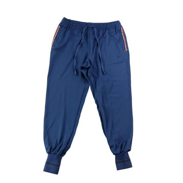 Spodnie dresowe męskie Nike. Niebieskie spodnie sportowe męskie Nike, l, bez wzorów, z dresówki, do biegania. Za 124.96 zł.